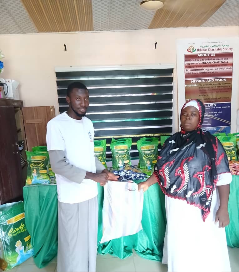 Donation items being given to widows as part of a welfare programme