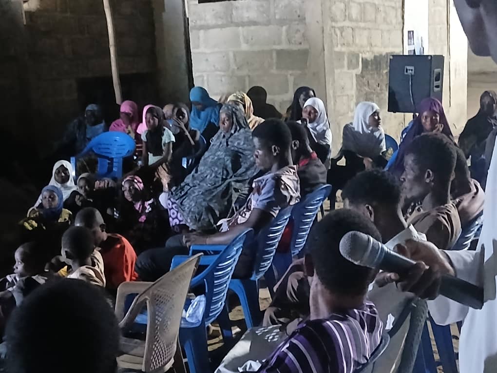 Night dawa gathering in a village with community members