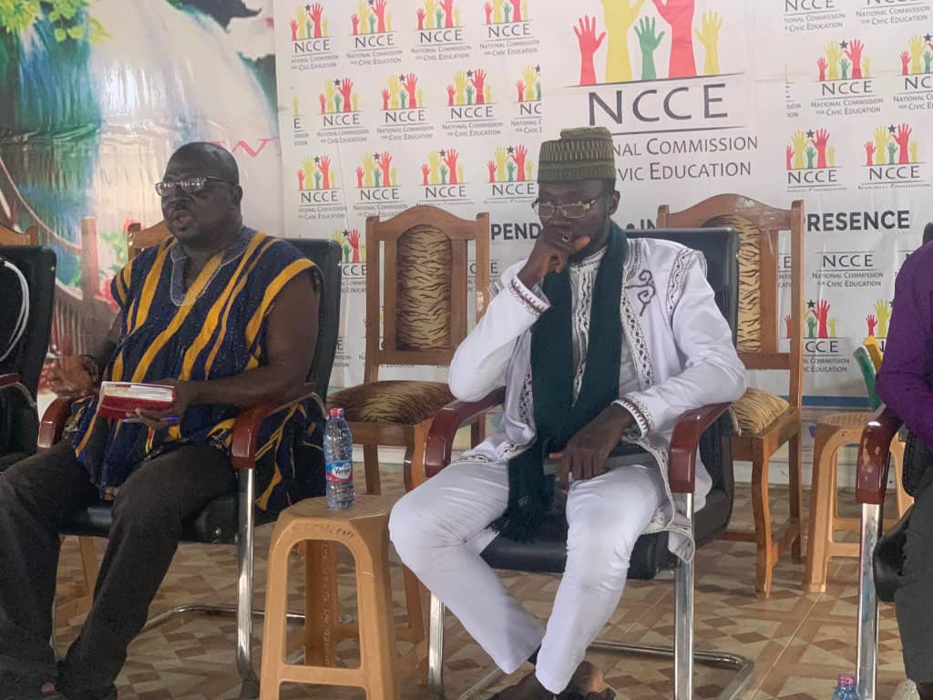 Sheikh Ishaque Abdallah seated on high table at the National Commission for Civic Education